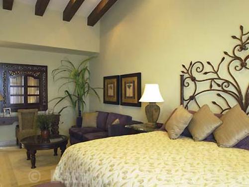 king bed with artisan designed headboard.