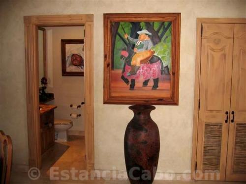artisan wall art and an artisan vase as part to the decor in villa 1402