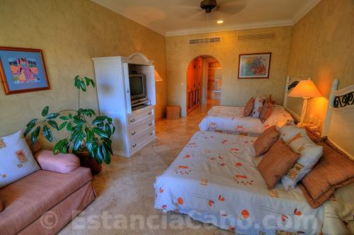 The second bedroom features 2 queen beds and a private bathroom.