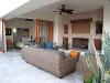 Seating area in front of the outdoor fireplace of the Penthouse 3806 of Villa La Estancia Cabo.