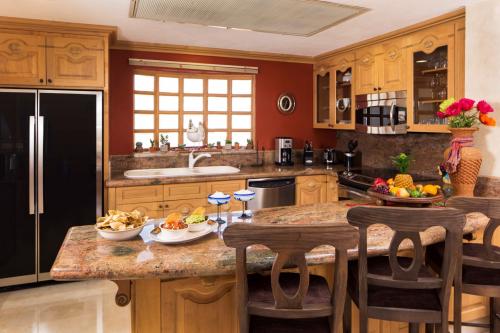 The Proffesional Gourmet Kitchen is fully equiped with top of the line stainless steel appliances.  The Kitchen also has granite countertops.
